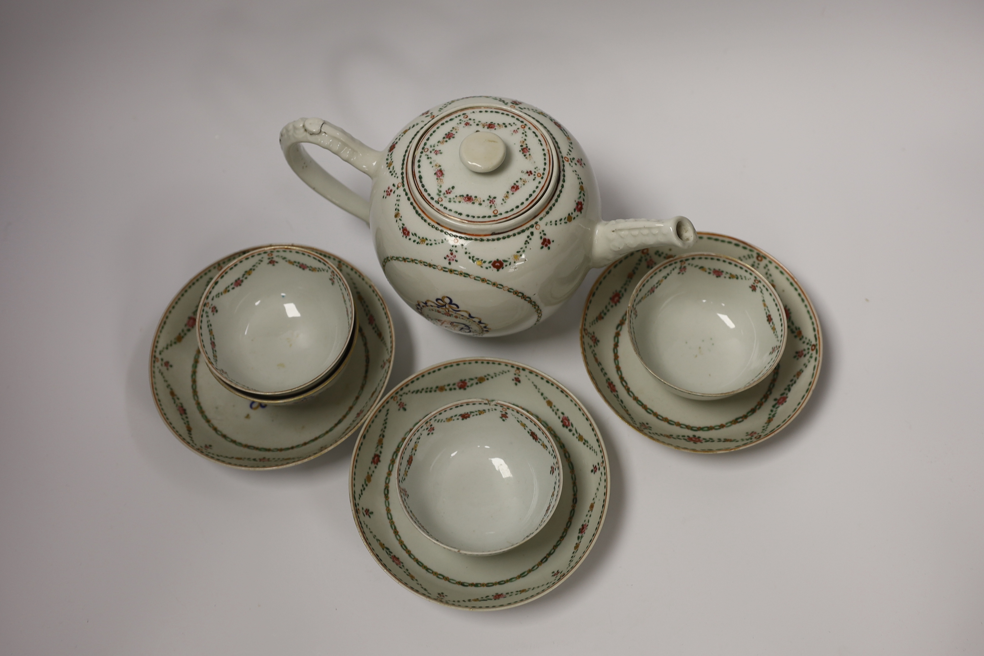 A Chinese export famille rose teapot, four tea bowls and three saucers, all Jiaqing period